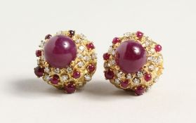 A SUPERB PAIR OF 18CT GOLD CARBOUCHON RUBY AND DIAMOND CLIP EARRINGS.
