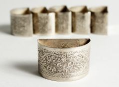 A SET OF SIX SRI LANKAN SILVER SERVIETTE RINGS. 105g gross weight