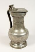 A SWISS PEWTER JUG 9.5ins high.