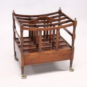 A GOOD MAHOGANY CANTERBURY, four division with long drawers on turned legs with brass casters. 1ft