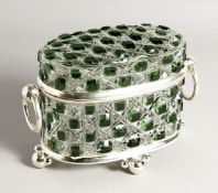 A CUT GLASS OVAL CASKET with ring handles