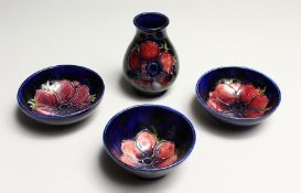 FOUR SMALL PIECES OF MOORCROFT a vase 3.5ins high and 3 bowls 3.5ins diameter.