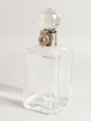A HEAVY SQUARE GLASS WHISKY DECANTER AND STOPPER with silver band.