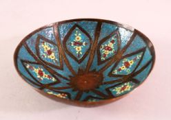 A GOOD SYRIAN ENAMEL BOWL, with floral decoration and a turquoise ground, 14cm