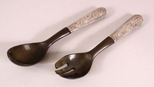 AN ASIAN CARVED RHINO HORN & WHITE METAL SERVING SET, comprising two items formed of horn with