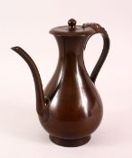 A JAPANESE MEIJI BRONZE TEMPLE EWER, used by monks with a hinged lid, and script to the base, 26cm