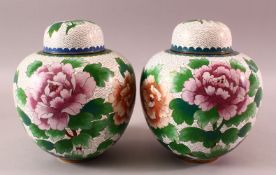 A PAIR OF CHINESE CLOISONNE GINGER JARS & COVERS, each with a white ground and floral decoration,
