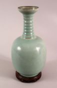 A CHINESE SONG STYLE RU WARE VASE, with incised calligraphy to the body, ribbed neck and carved