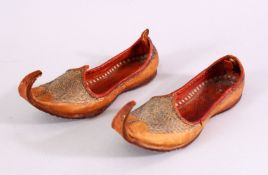 A SMALL PAIR OF 19TH CENTURY OTTOMAN EMBROIDERED SHOES, 15cm long.