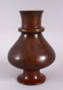 A 19TH CENTURY ISLAMIC PERSIAN BRONZE CALLIGRAPHIC VASE, the body with roundel motif decoration with