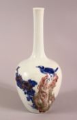 A CHINESE UNDERGLAZED BLUE & COPPER RED PORCELAIN VASE, decorated with birds and landscapes, 24cm