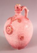 A EUROPEAN PINK GLAZED POTTERY BOTTLE FOR THE ISLAMIC MARKET, with moulded floral decoration and a
