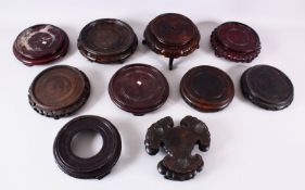 A MIXED LOT OF 10 CHINESE CARVED HARDWOOD STANDS - each of varying size, style and timber, the