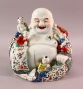 A GOOD CHINESE REPUBLIC PERIOD FAMILLE ROSE PORCELAIN FIGURE OF BUDDHA, seated with young attendant,