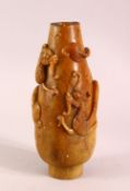 A CHINESE CARVED SOAPSTONE VASE, carved with dragons to the body, 23cm