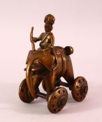 A 19TH CENTURY INDIAN BRONZE ELEPHANT TOY, the elephant on wheels with a man seated, 13.5cm