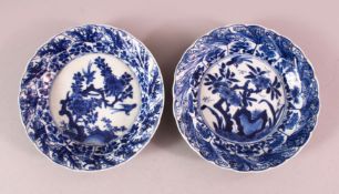A PAIR OF CHINESE KANGXI PERIOD BLUE & WHITE PORCELAIN SAUCER DISHES, each decorated with floral