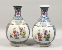 A GOOD PAIR OF KANGXI DESIGN BLUE GROUND BULBOUS VASES, painted with figures.