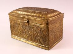 A FINE 18TH CENTURY SOUTH INDIAN ENGRAVED BRASS CASKET depicting Hindu gods, 26cm long, 16cm high,