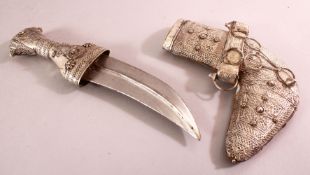 A GOOD SILVER JAMBIYA DAGGER, with embossed foil silver decorations, 25cm