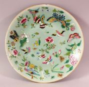 A 19TH CENTURY CHINESE CELADON FAMILLE ROSE PORCELAIN PLATE, With decoration of birds, flowers and