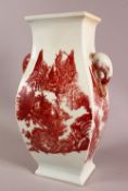 A CHINESE IRON RED PORCELAIN TWIN HANDLE VASE, decorated in copper red with landscape views, with