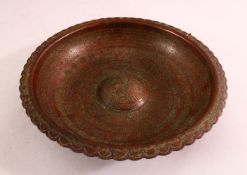 A GOOD PERSIAN ENGRAVED SIGNED BRASS MAGIC BOWL, the interior carved with a profuse amount of