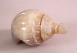 A GOOD INDIAN MUGHAL CARVED JADE POWDER FLASK, with a screw top, 9cm