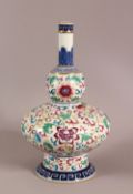 A CHINSE UNUSUAL FORMED FAMILLE ROSE PORCELIAN VASE, decorated with scrolling lotus display, the