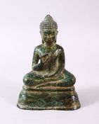 A CHINESE BRONZE FIGURE OF BUDDHA, in a seated position upon lotus, 11.5cm high