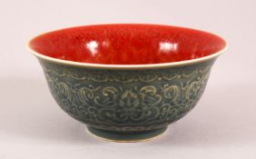 AN UNUSUAL CHINESE DARK BLUE & FLAMBE PORCELAIN BOWL, the body of the bowl with moulded lotus