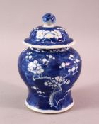 A 19TH / 20TH CENTURY CHINESE BLUE & WHITE PORCELAIN PRUNUS JAR & COVER, with prunus decoration,
