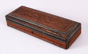 A 19TH / 20TH CENTURY INDIAN CARVED WOODEN BOX, carved with temples, animals and foliage, with