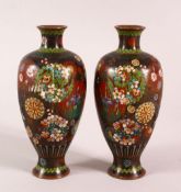 A PAIR OF SMALL CLOISONNE VASES OF RIBBED BALUSTER FORM, decorated with roundels of flowers, 15cm