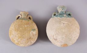 TWO 10TH CENTURY IRANAIN POTTERY TWIN HANDLE BOTTLES, each with traces of turquoise glaze to the