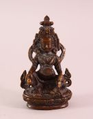 A SNALL 19TH CENTURY TIBETAN BRONZE FIGURE OF JAMBHALA, holding a mongoose, 9.5cm.