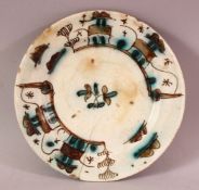 A CHINESE SAFAVID POTTERY DISH, with landscape decoration, 20cm