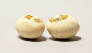 A PAIR OF SMALL CHINESE IVORY EGGS AND CHICKS, 1.5ins high.