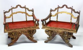 A PAIR OF 19TH/20TH CENTURY THAI CARVED HOWDAH ELEPHANT CHAIRS, profusely carved and pierced with
