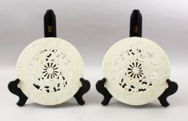 TWO 20TH CENTURY CHINESE CARVED HARDSTONE / JADELIKE BI - DISKS, each disk carved with phoenix birds