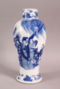 A CHINESE BLUE & WHITE VASE, decorated with figures in a landscape, the base with a four character