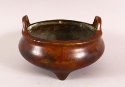 A CHINESE BRONZE TWIN HANDLE CENSER, the base with a seal mark, 13cm