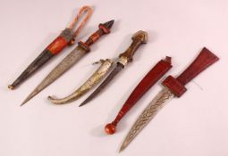 THREE NORTH AFRICAN DAGGERS.
