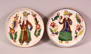 A PAIR OF OTTOMAN KUTAHYA POTTERY PLATES, each decorated with figures, 12cm