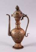 A TIBETAN SILVER EWER AND COVER, 22.5cm high.