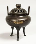 A CHINESE TWO HANDLED BRONZE CENSER AND COVER, 5ins high.