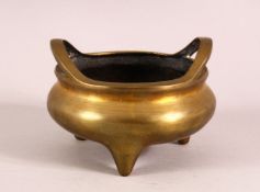 A CHINESE BRONZE TWIN HANDLE CENSER, The underside with an impressed seal, 13cm