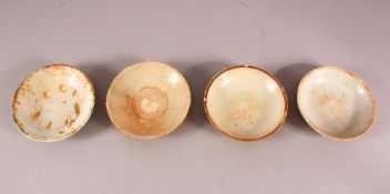 FOUR EARLY CHINESE POTTERY BOWLS, of varying style and size (4)