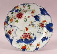 AN 18TH CENTURY CHINESE QIANLONG PERIOD TOBACCO LEAF PORCELAIN PLATE, 23cm.