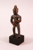 A SMALL EARLY CHINESE BRONZE FIGURE OF BUDDHA HOLDING A BOTTLE, poss neolithic, mounted to a base,